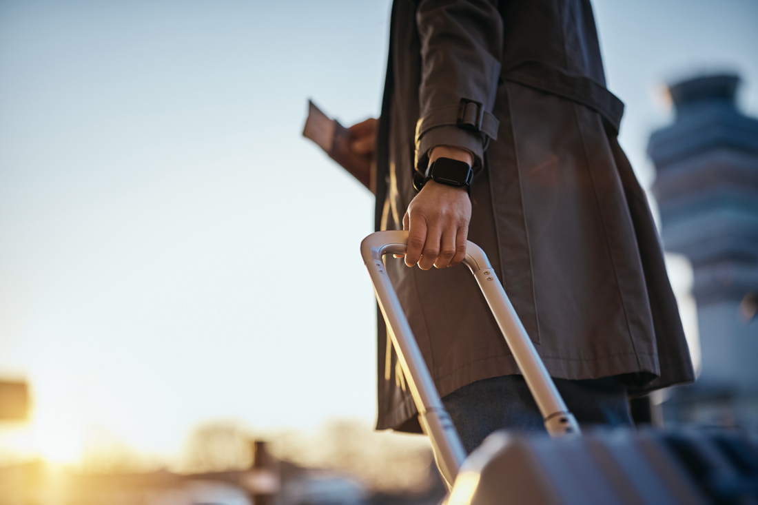 Traveller holding passport and boarding pass at airport