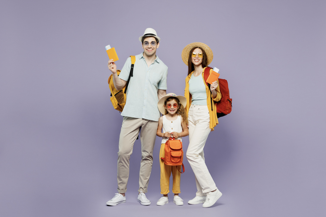 Newcomer family arriving in Canada with suitcases