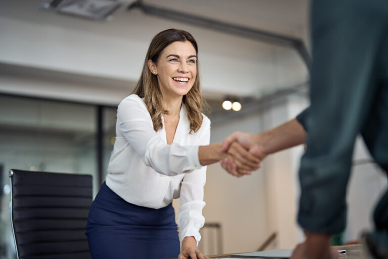 Immigration consultant greeting IEC applicant professionally