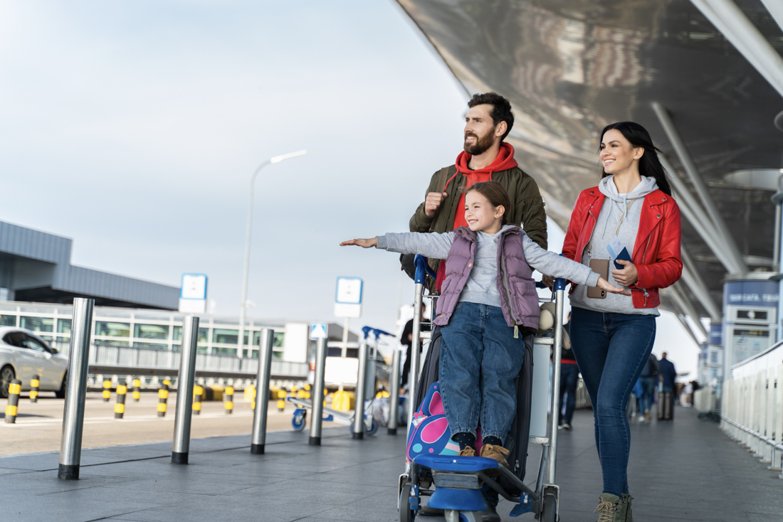 Newcomer family at Canadian airport with immigration documents