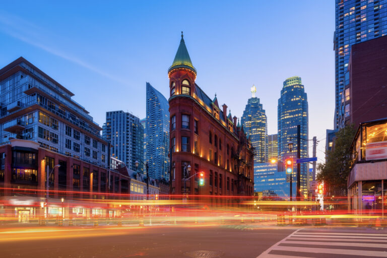 Toronto tech district skyline with evening traffic trails