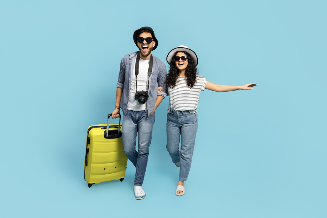 Newcomer checking departures with passport for TEF Canada exam