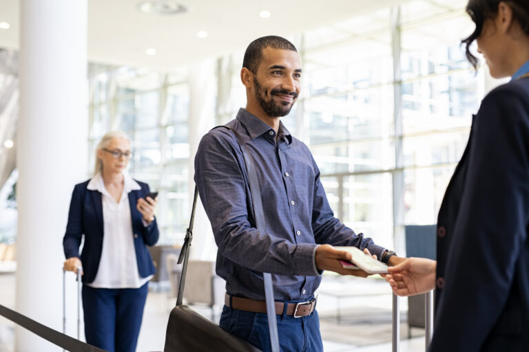 Newcomer presenting passport for work permit renewal process