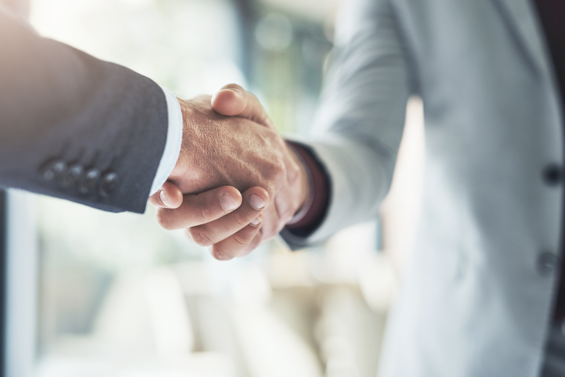 Employer and applicant shaking hands after LMIA consultation