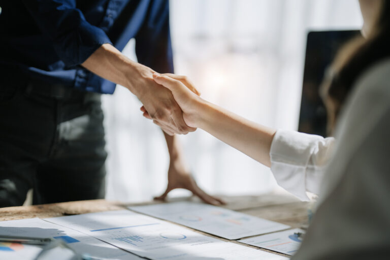 Employer and applicant shaking hands after LMIA consultation