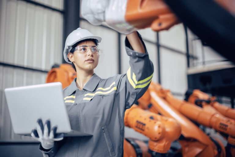 Engineer on work permit in Canada factory setting