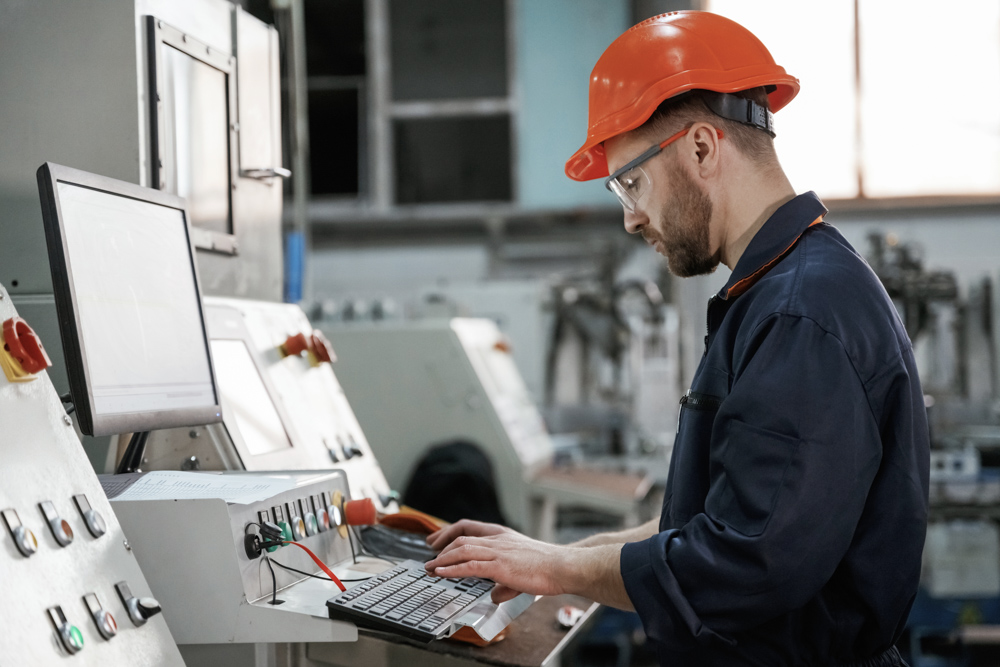 Engineer on work permit in Canada factory setting