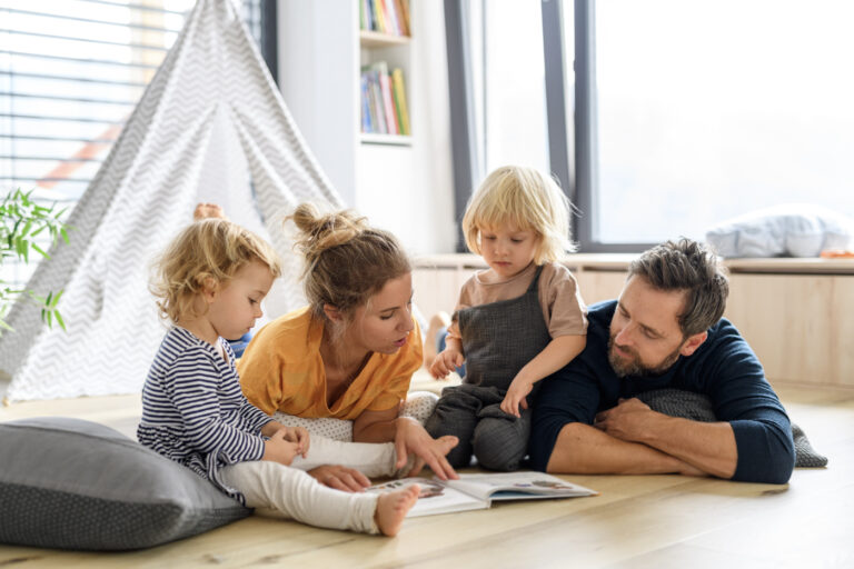 Family reading together at home pgp sponsorship success