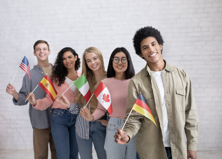Diverse international students with Canada study visa flags