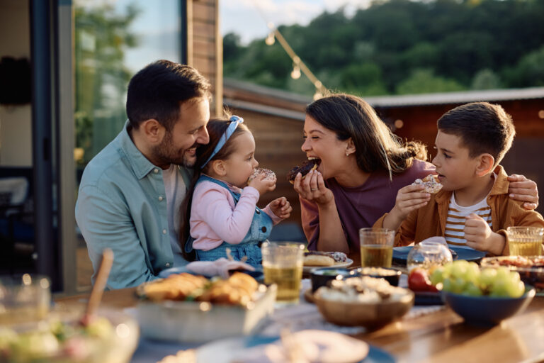 Family enjoying meal; Canadian immigration journey