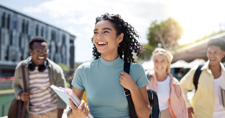 International students on Canadian campus smiling together