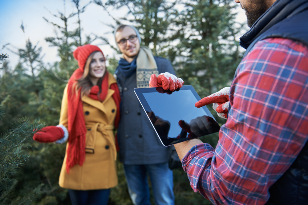 Happy newcomer holding Canadian flag
