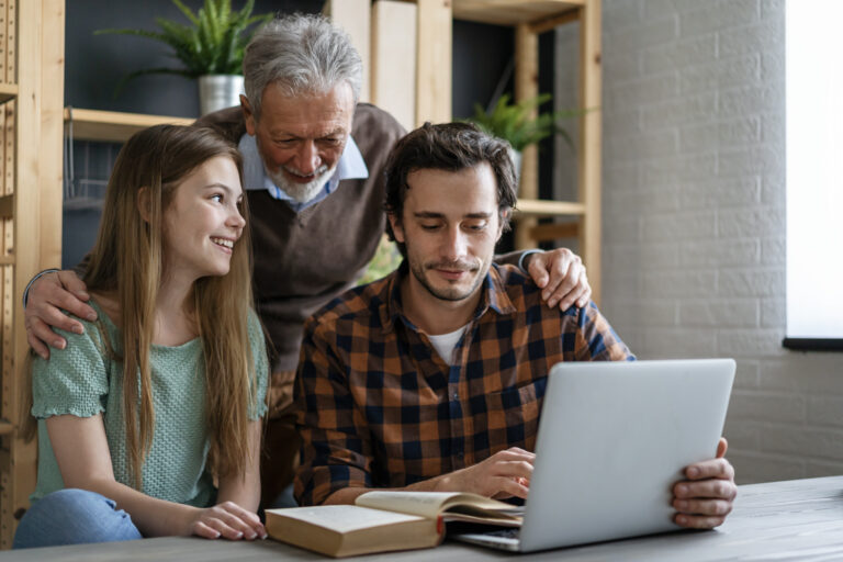 Family reviewing Super Visa details online