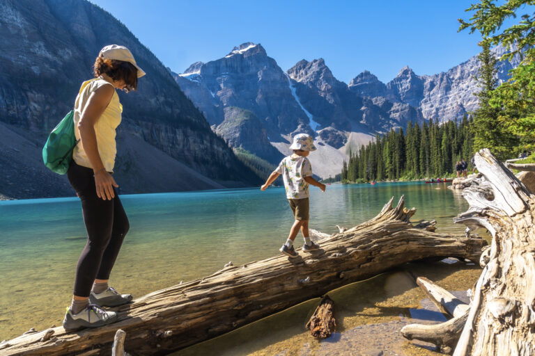 Mother and child exploring Canadian lake