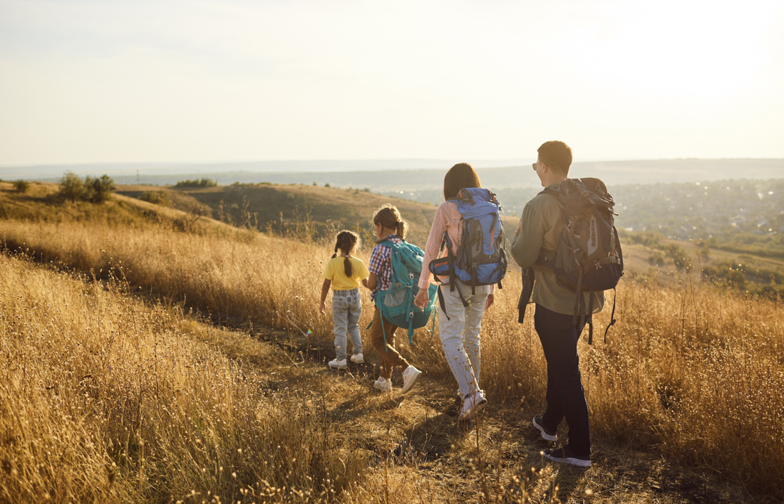 Newcomers embracing at airport Canada