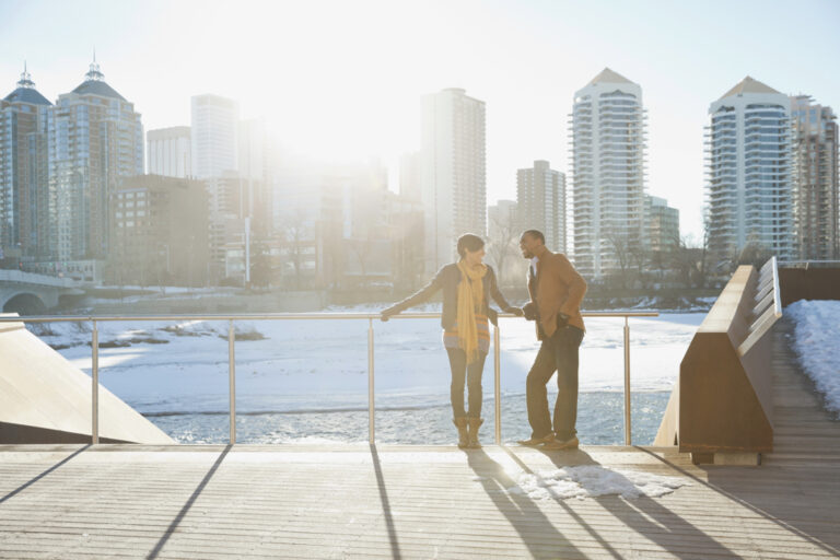 Couple enjoying winter cityscape in Canada