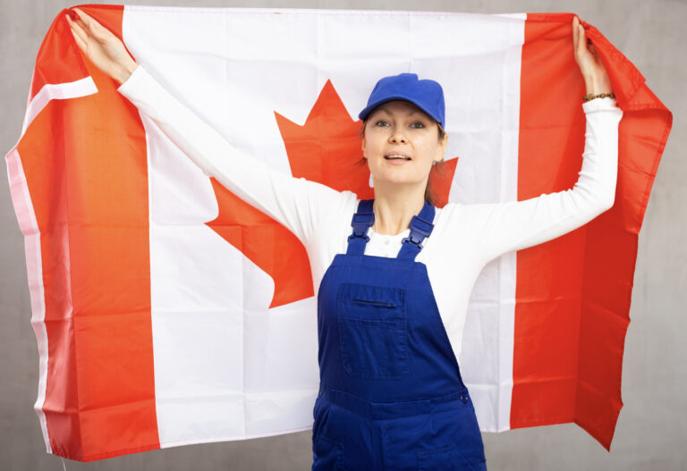 Worker holding Canadian flag proudly