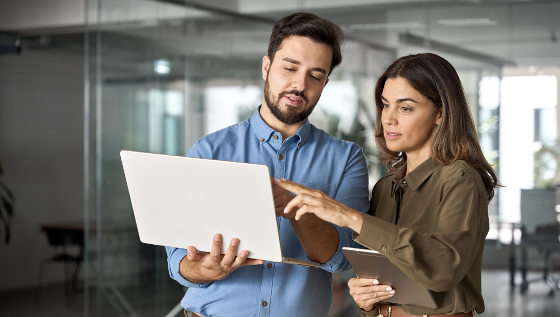 People reviewing PRTD application on laptop