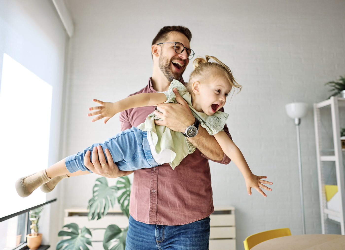 Man playing with child, Canada family sponsorship