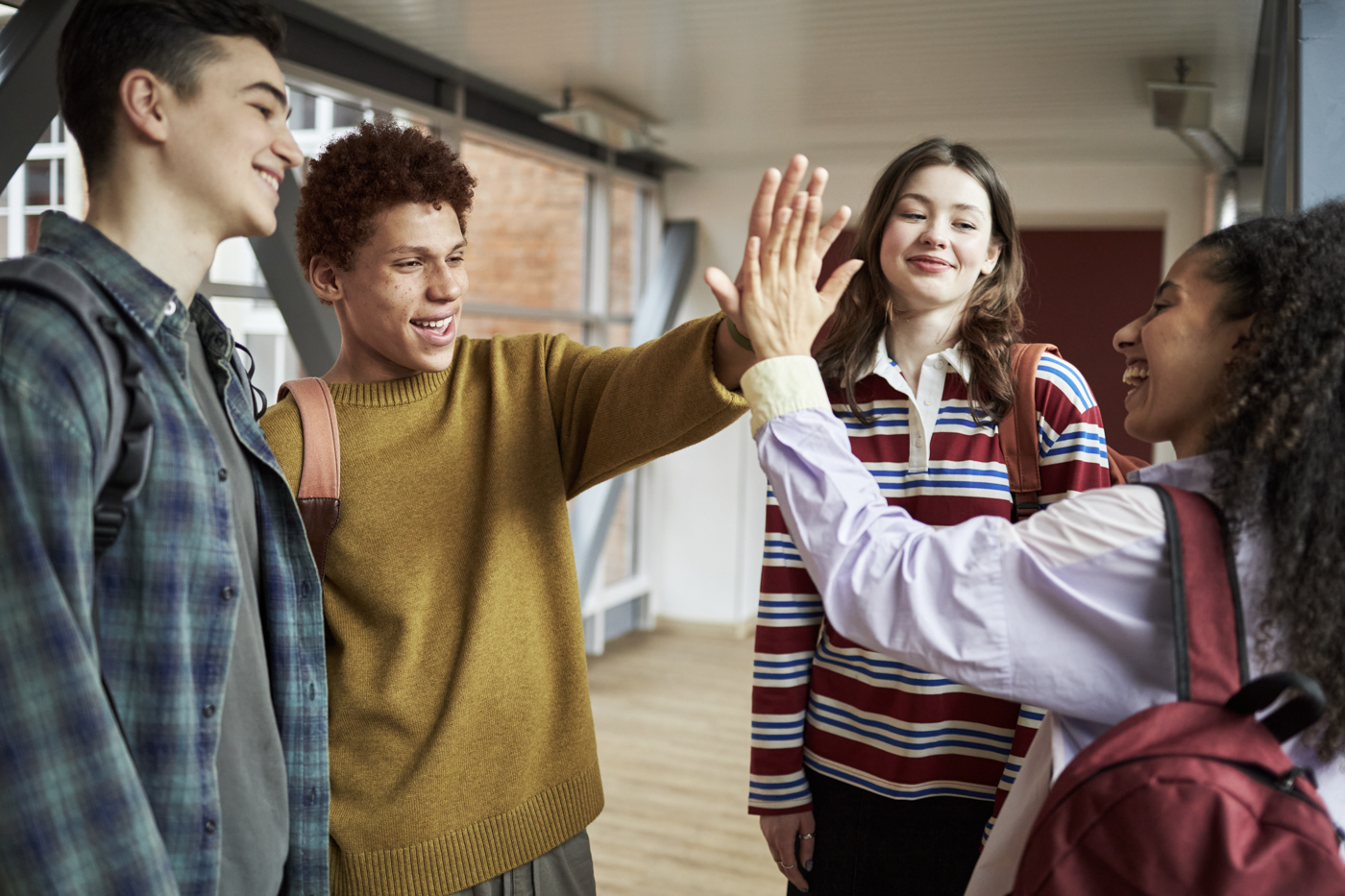 Students high-fiving for PGWP eligibility