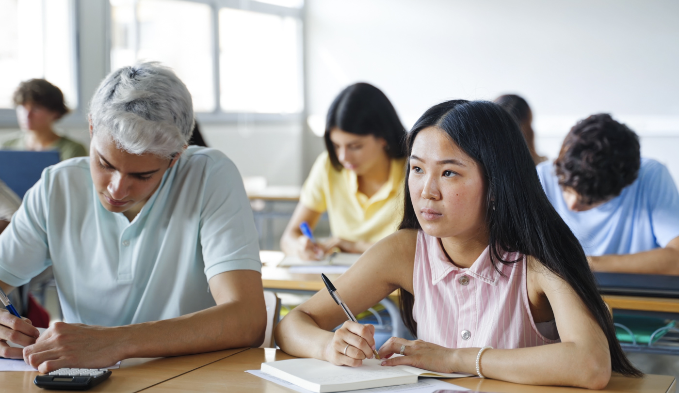 Students writing notes during PGWP waiting time