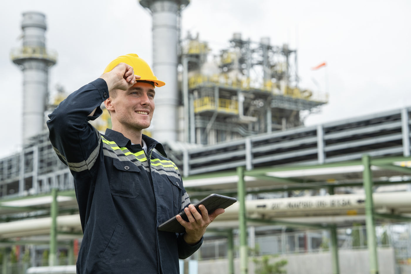 Industrial labour worker holding tablet